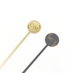 Two gold and one gray stirrer with 'CIM' logo on a white background